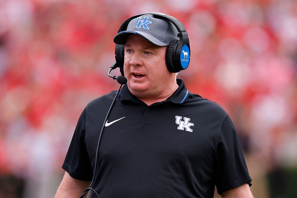 Mark Stoops asserts he's staying put at Kentucky, yet a lucrative buyout could yield over $40 million.